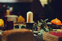 zoomed in table setting with candlestick in the center